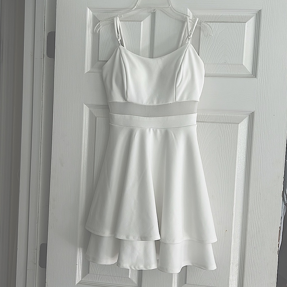 I wear this dress once. It’s super cute! Size small, white dress.